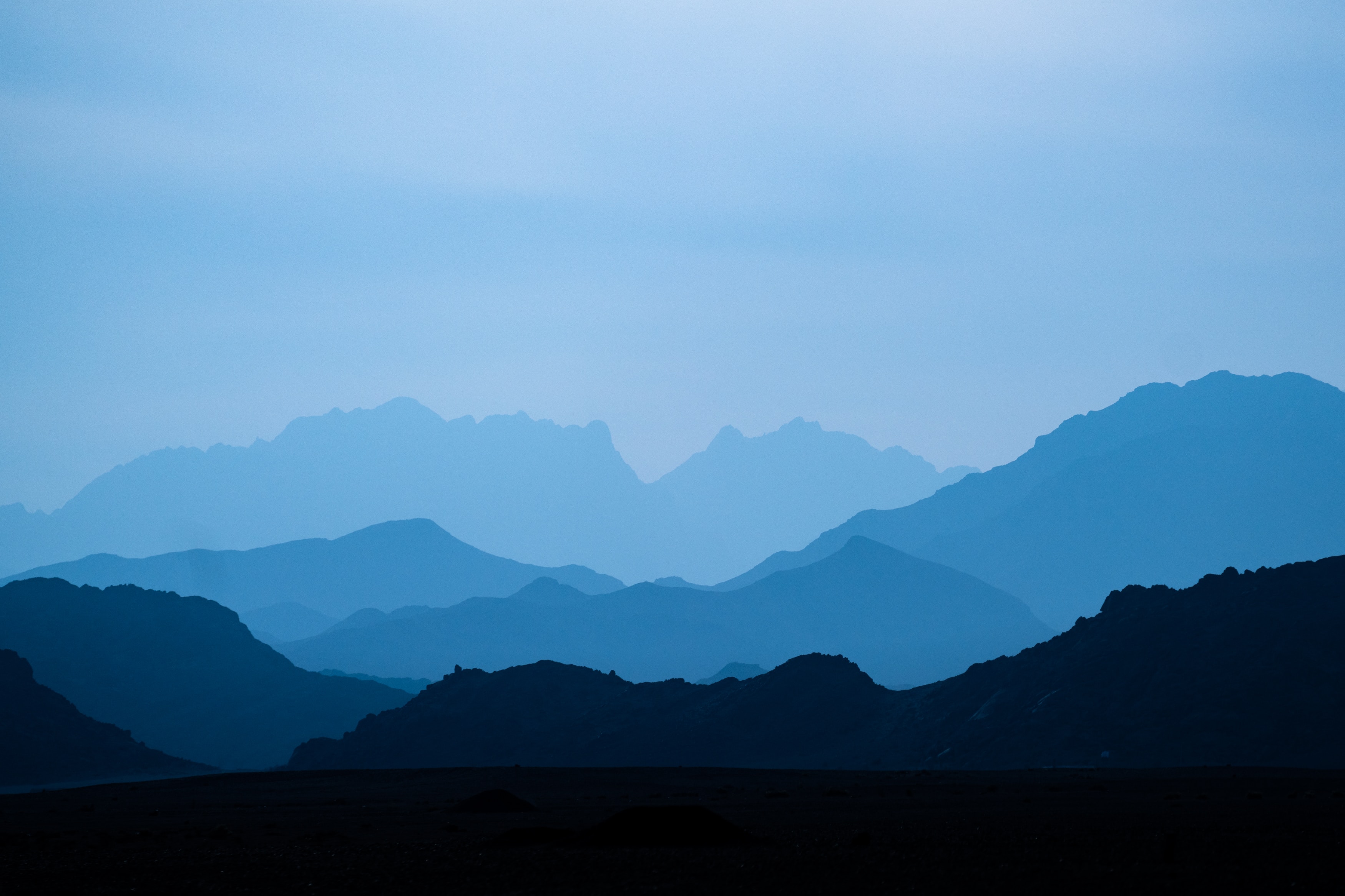 Atmospheric blue mountain landscape by Jeremy Bishop